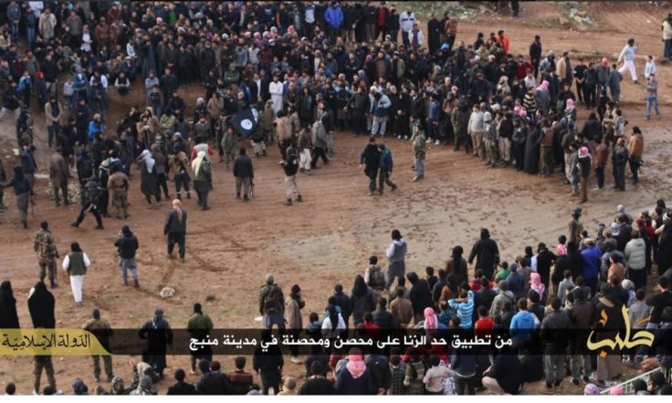 A crowd watch a man and a woman being stoned to death for adultery in Manbij, Syria A crowd watch a man and a woman being stoned to death for adultery in Manbij, Syria