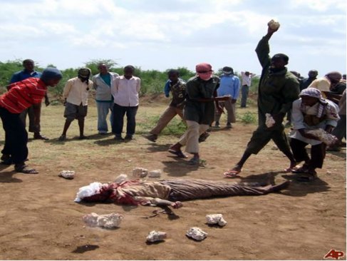 An adulterer being stoned to death for adultery in Somalia An adulterer being stoned to death for adultery in Somalia